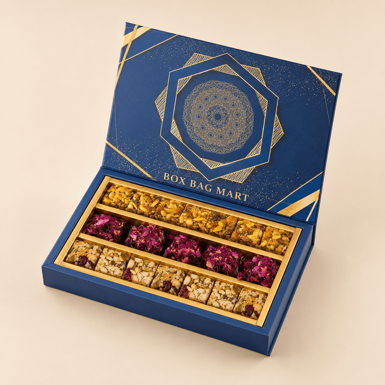 BOX BAG MART royal blue and gold custom-printed luxury sweet and dry-fruit packaging box with assorted mithai compartments.
